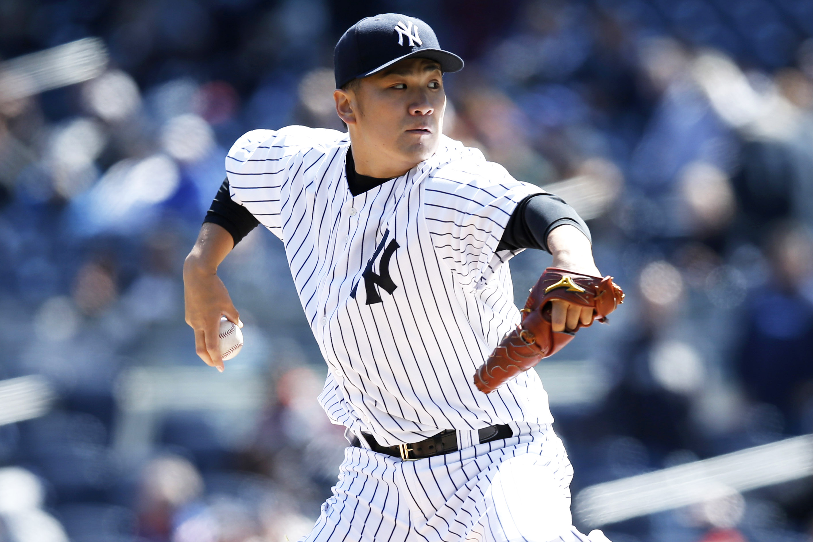 New York Yankees starting pitcher Masahiro Tanaka delivers in the first inning of the first game of an interleague baseball doubleheader against the Chicago Cubs at Yankee Stadium in New York, Wednesday, April 16, 2014.  (AP Photo/Kathy Willens)