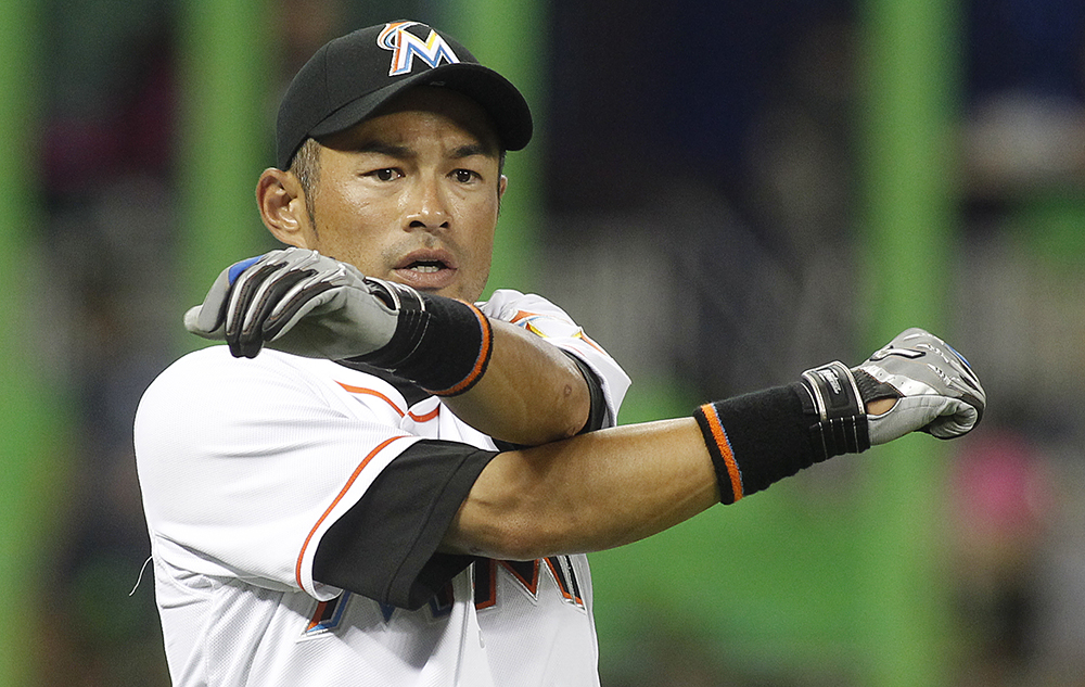 Miami Marlins right fielder Ichiro Suzuki, stretches on the field before the Marlins met the Atlanta Braves in their baseball game in Miami, Tuesday, April 7, 2015. (AP Photo/Joe Skipper)