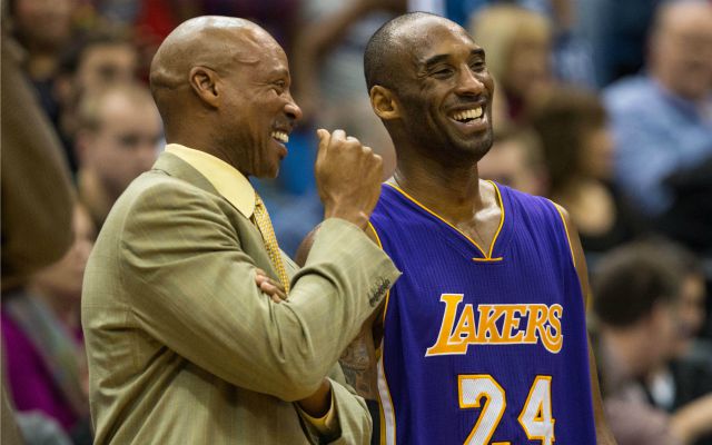 Dec 14, 2014; Minneapolis, MN, USA; Los Angeles Lakers guard Kobe Bryant (24) laughs with head coach Byron Scott during the fourth quarter against the Minnesota Timberwolves at Target Center. The Lakers defeated the Timberwolves 100-94. Mandatory Credit: Brace Hemmelgarn-USA TODAY Sports
